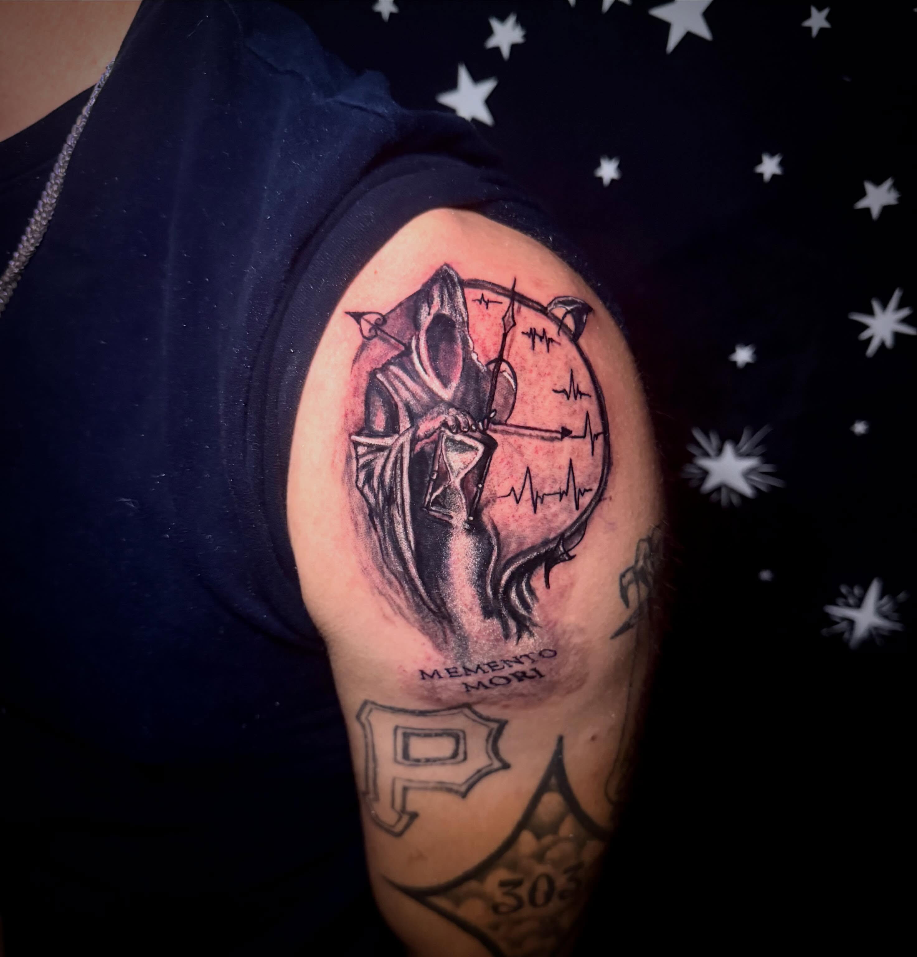 Grim reaper dark realism tattoo on the shoulder by Mikey