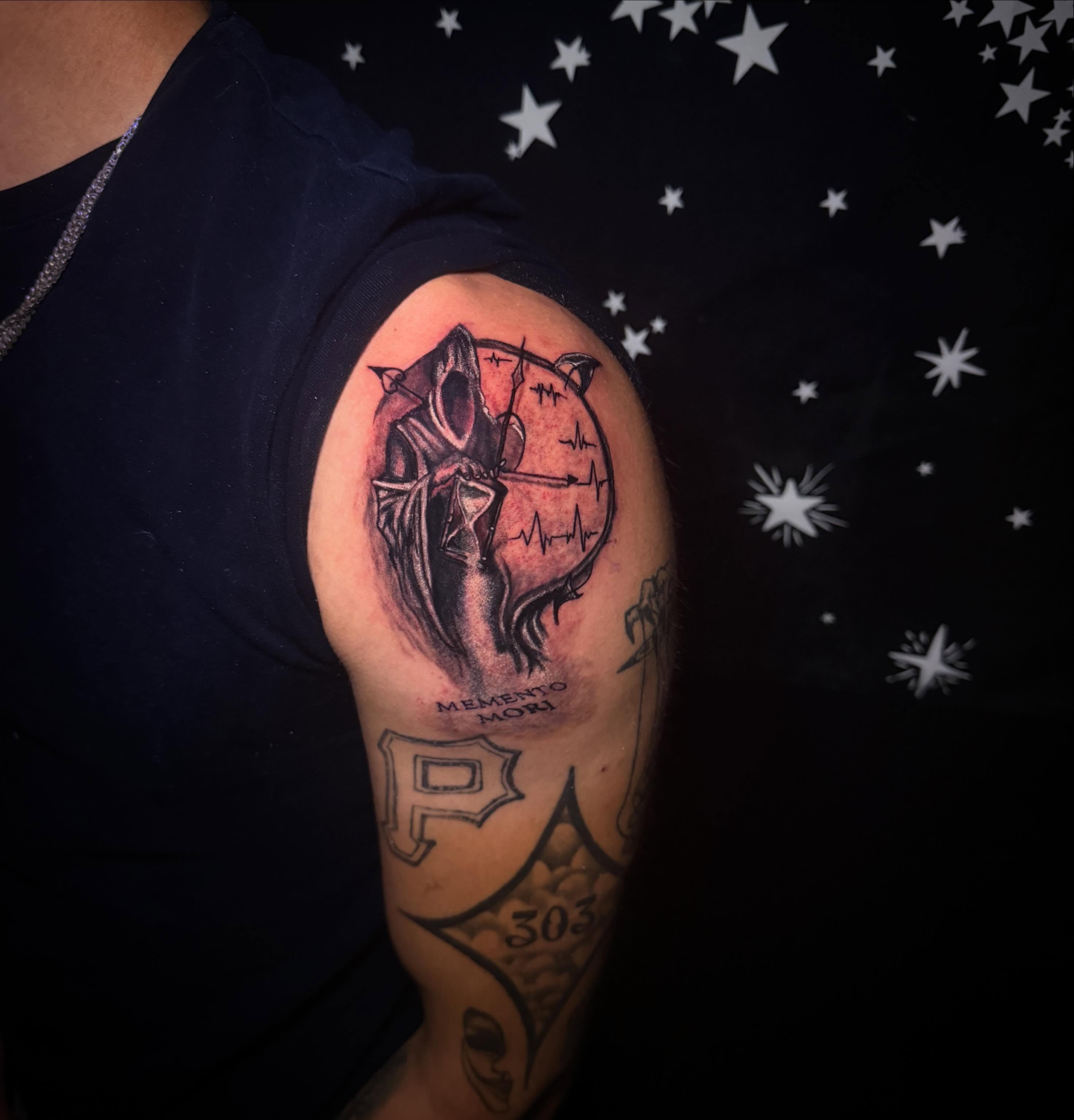 Death and clock dark realism tattoo on the shoulder by Mikey