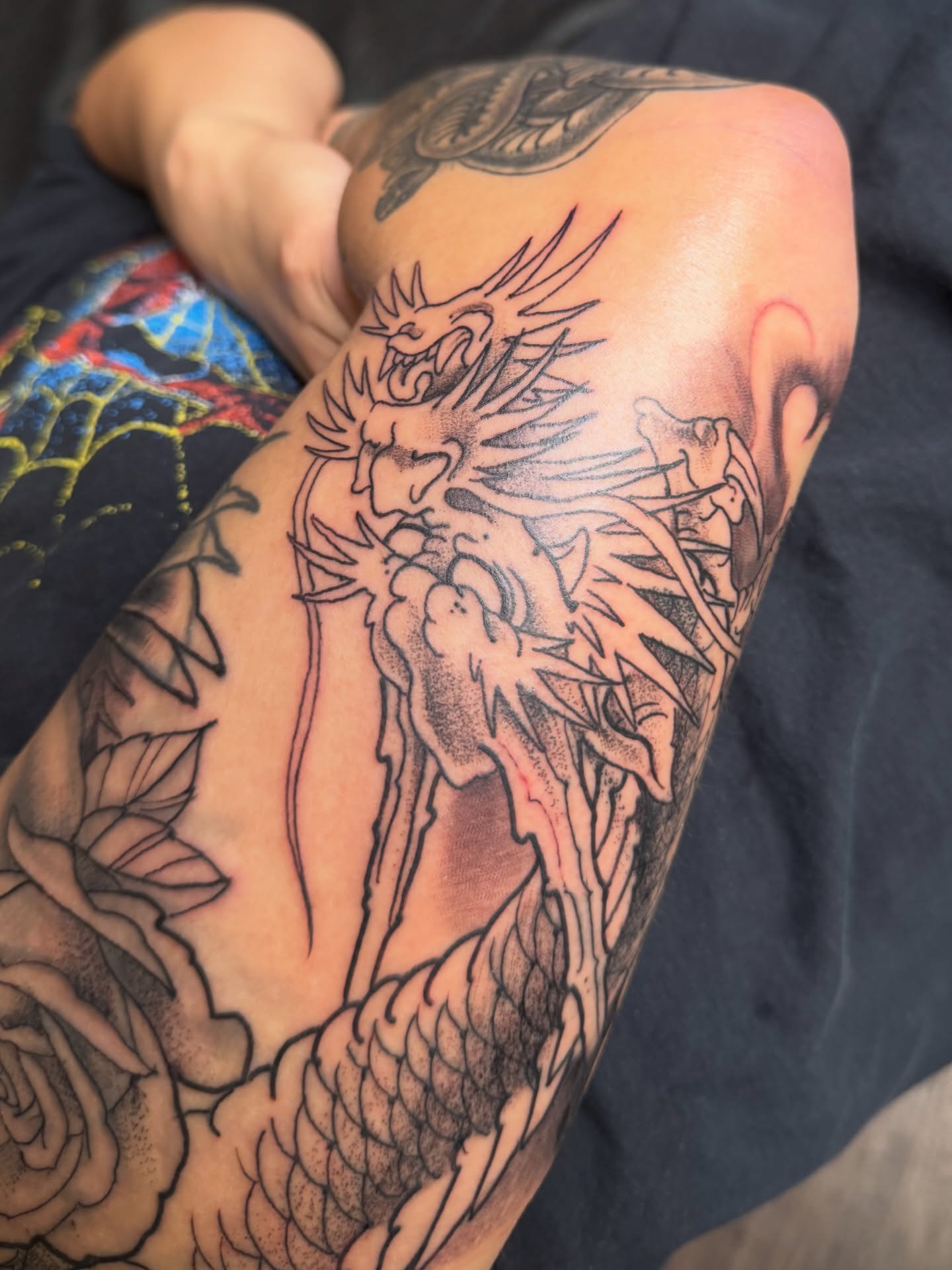 Dragon and woman realism tattoo on the forearm by Chris Cockrill