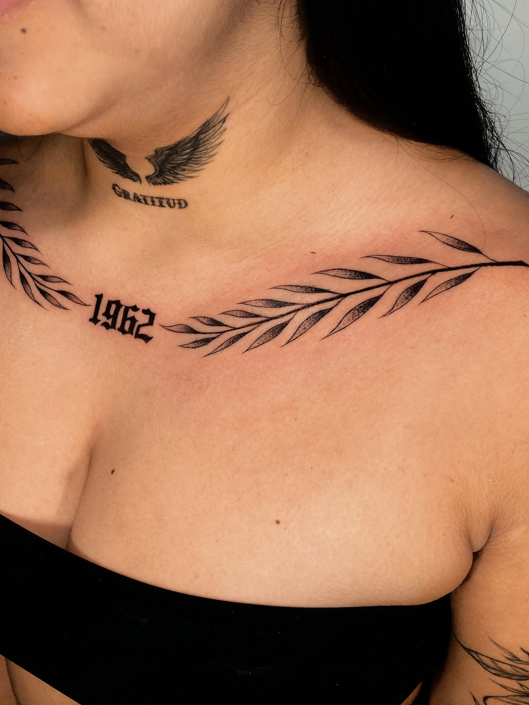 Laurel branch and year cyber sigilism tattoo on the chest by Alvaro