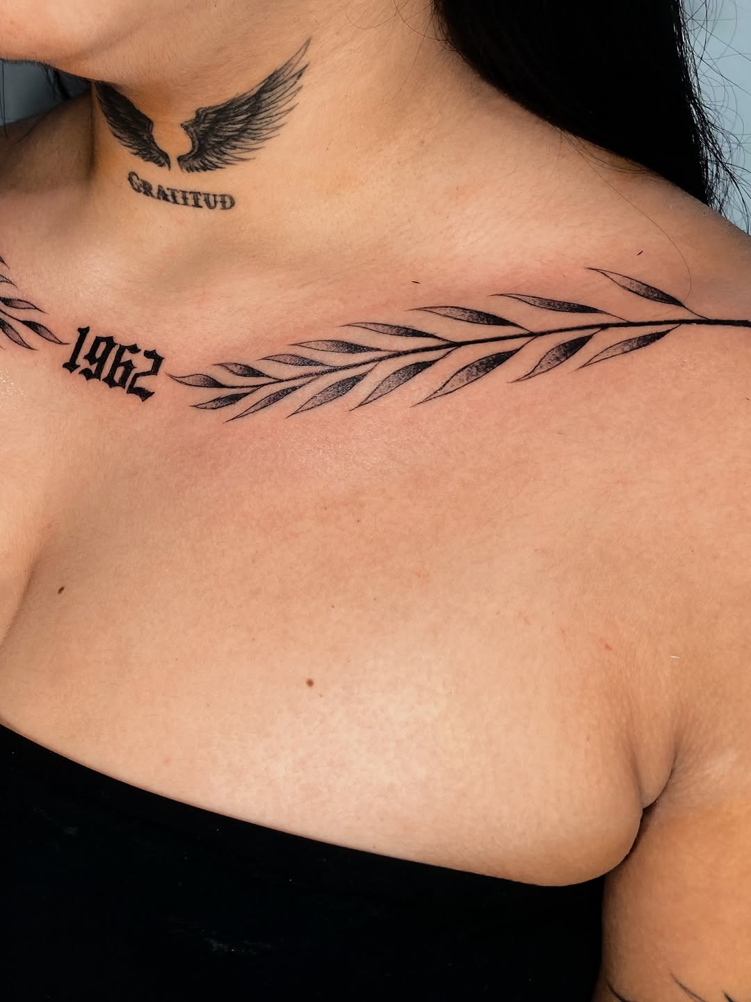 Laurel branch with year cyber sigilism tattoo on the chest by Alvaro