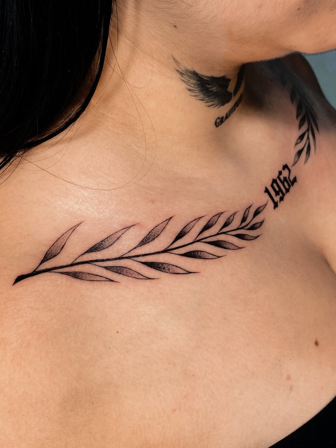 Laurel branch and year cyber sigilism tattoo on the chest by Alvaro