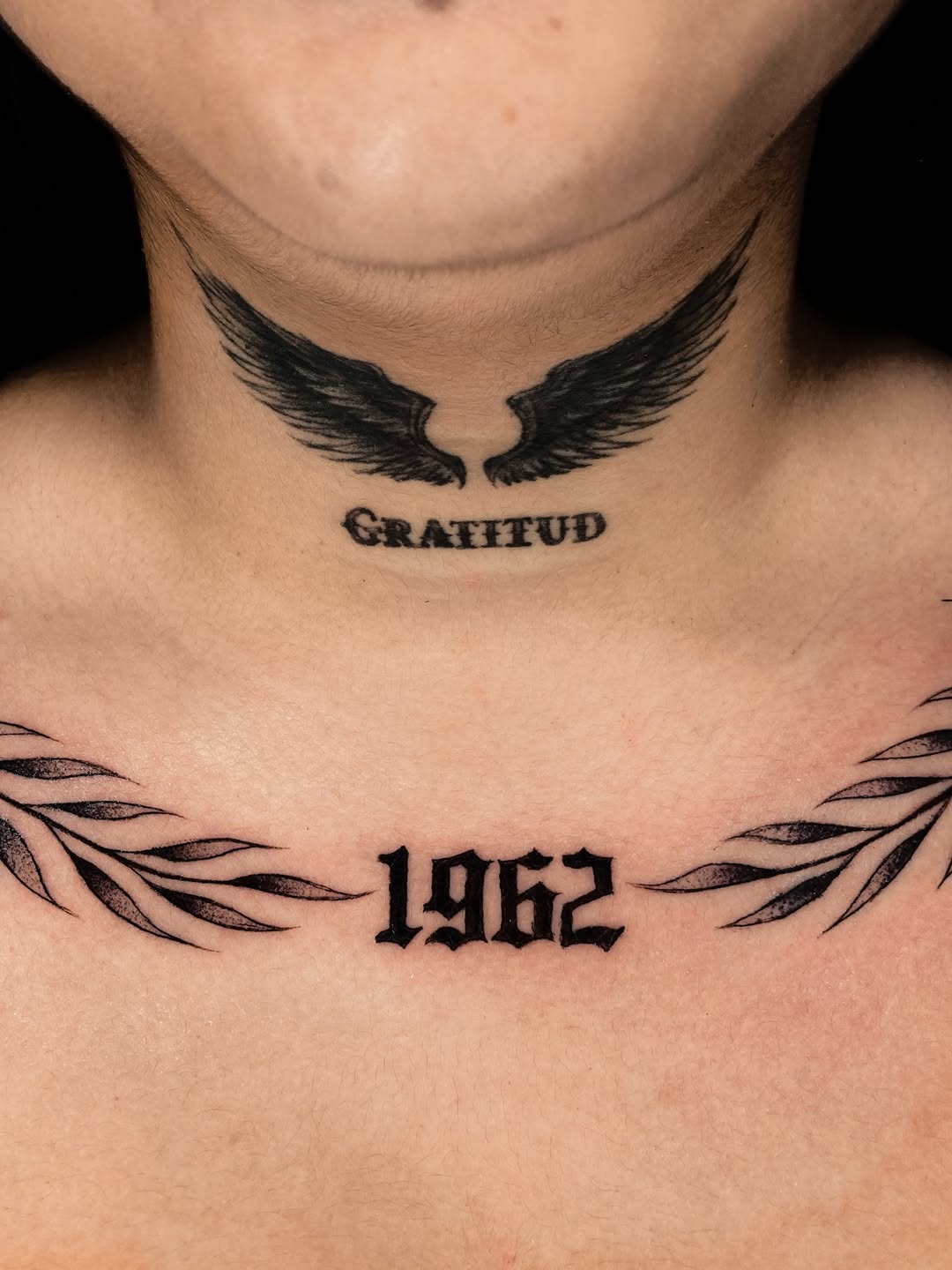 Wings and numbers Chicano tattoo on the neck by Alvaro
