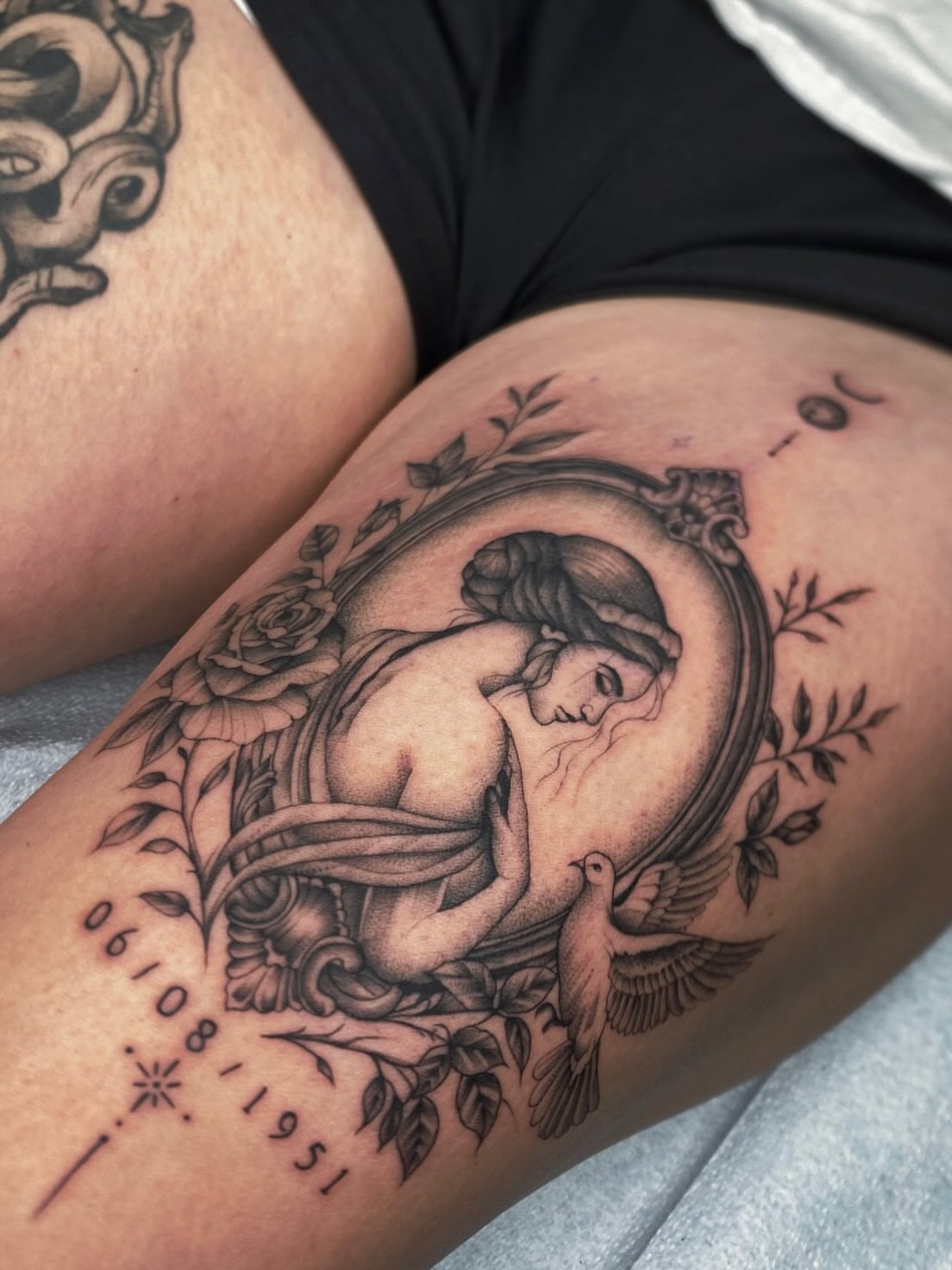 Sleeping woman realism tattoo on the thigh by Cody Mason