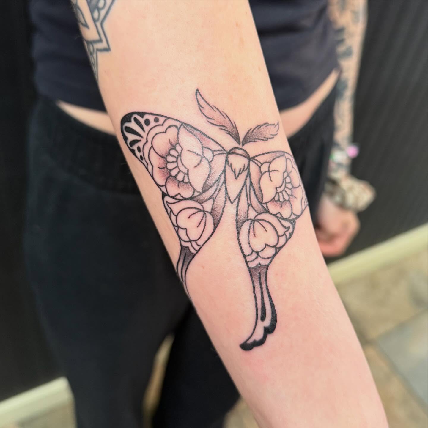 Flower moth black and grey tattoo on the forearm by Liz Glitz - Philadelphia Tattoo Artist