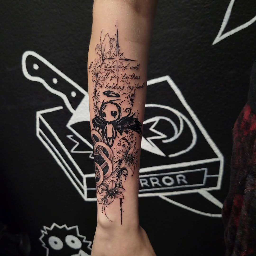 Angel with wings and flowers cyber sigilism tattoo on the forearm by Marina Cobb
