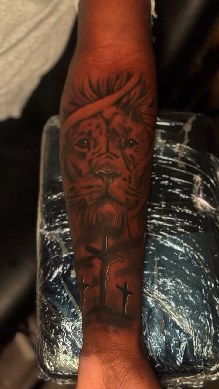 Lion and crosses realism tattoo by Dope