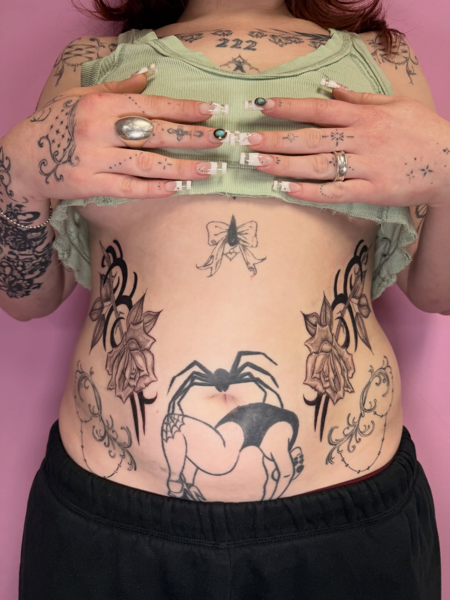 Spider and roses tribal tattoo on the torso by Maddie Blosser, Portland, Oregon