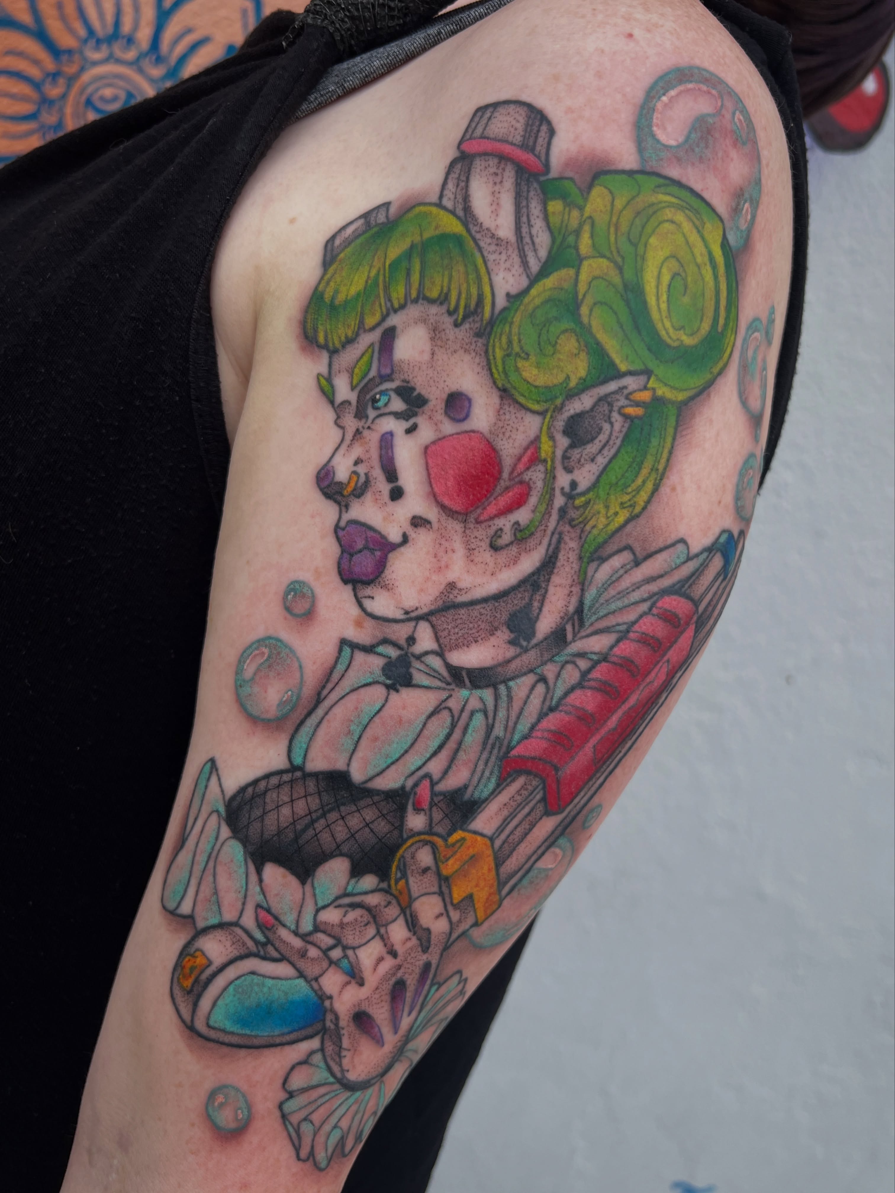 Clown dotwork tattoo on the upper arm by Owen Smith -OEOS- SF