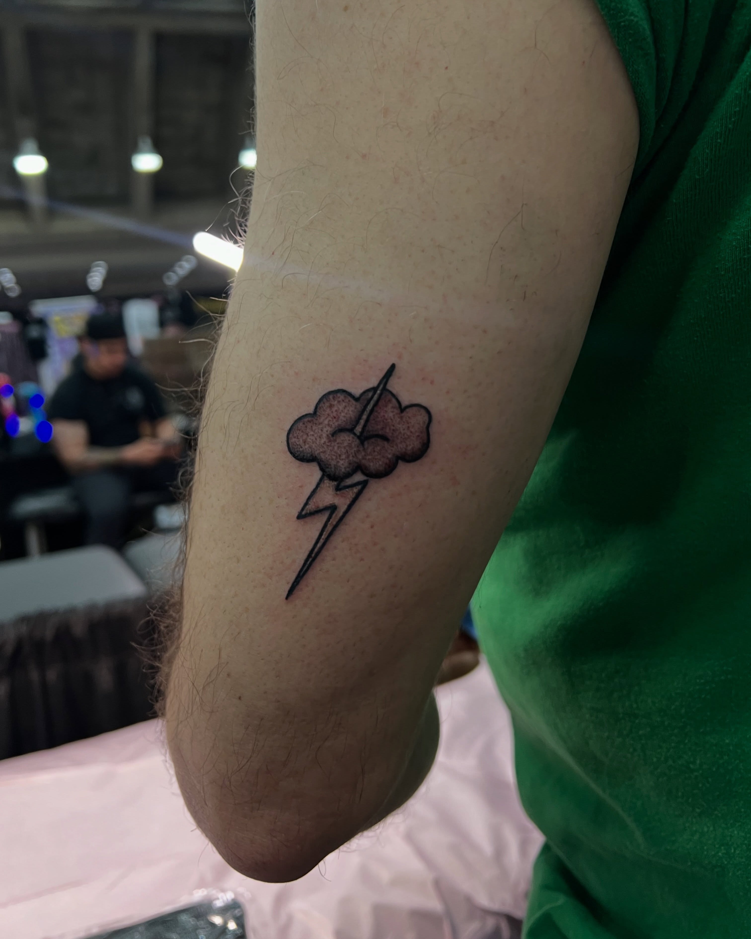 Lightning bolt dotwork tattoo on the forearm by Uncomfy Comfort Tattoos LLC