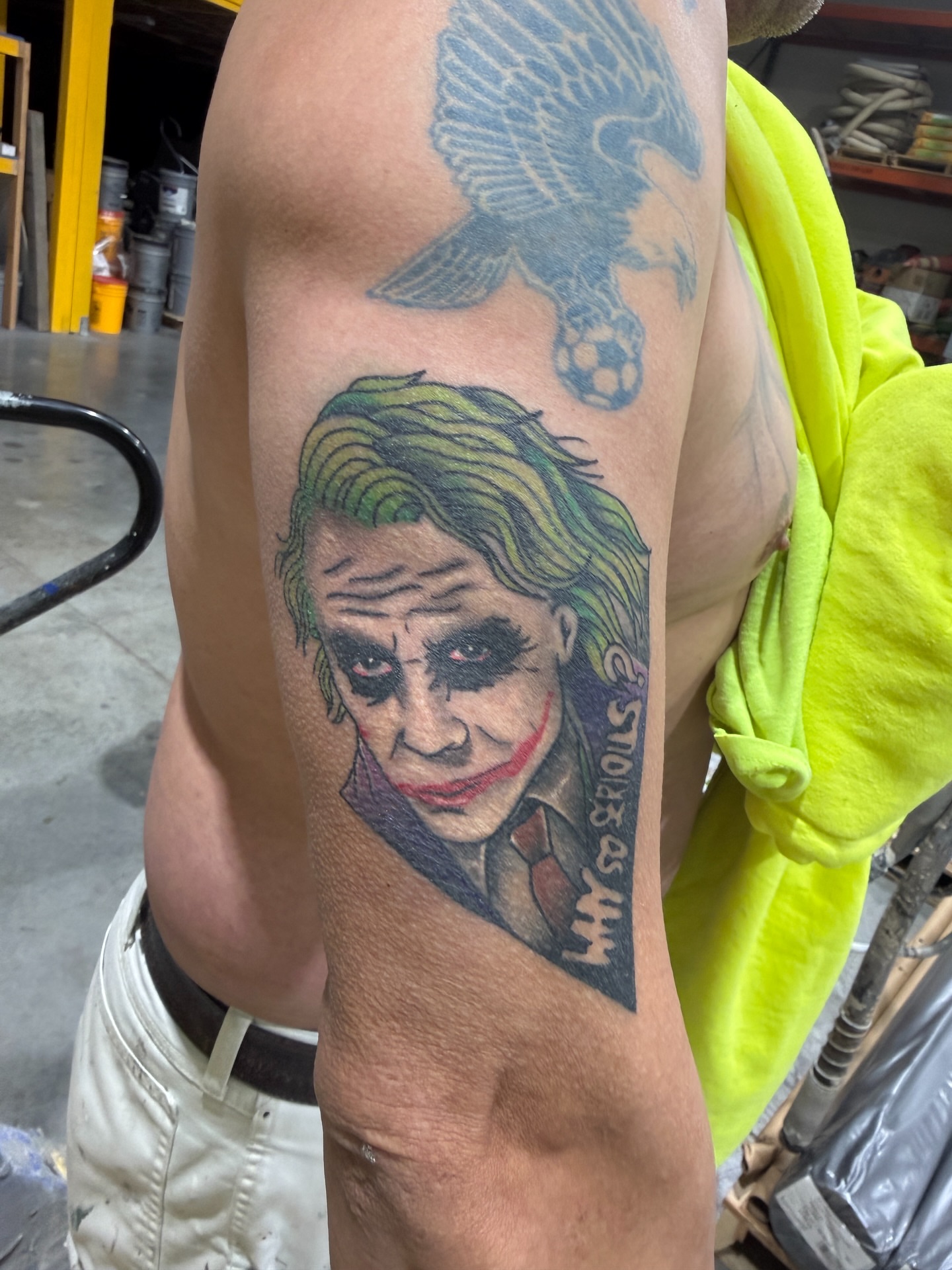 Joker realism tattoo on the forearm by Joshua Carter