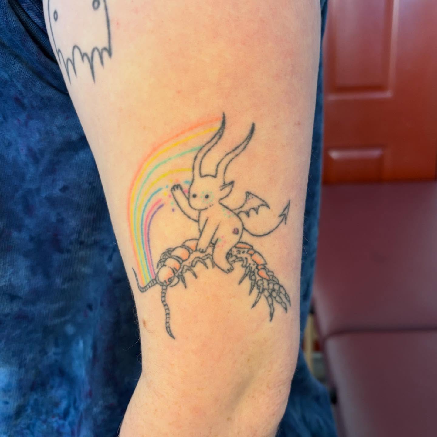 Chibi creature riding beetle illustrative tattoo on the forearm by ☠️mikauley☠️