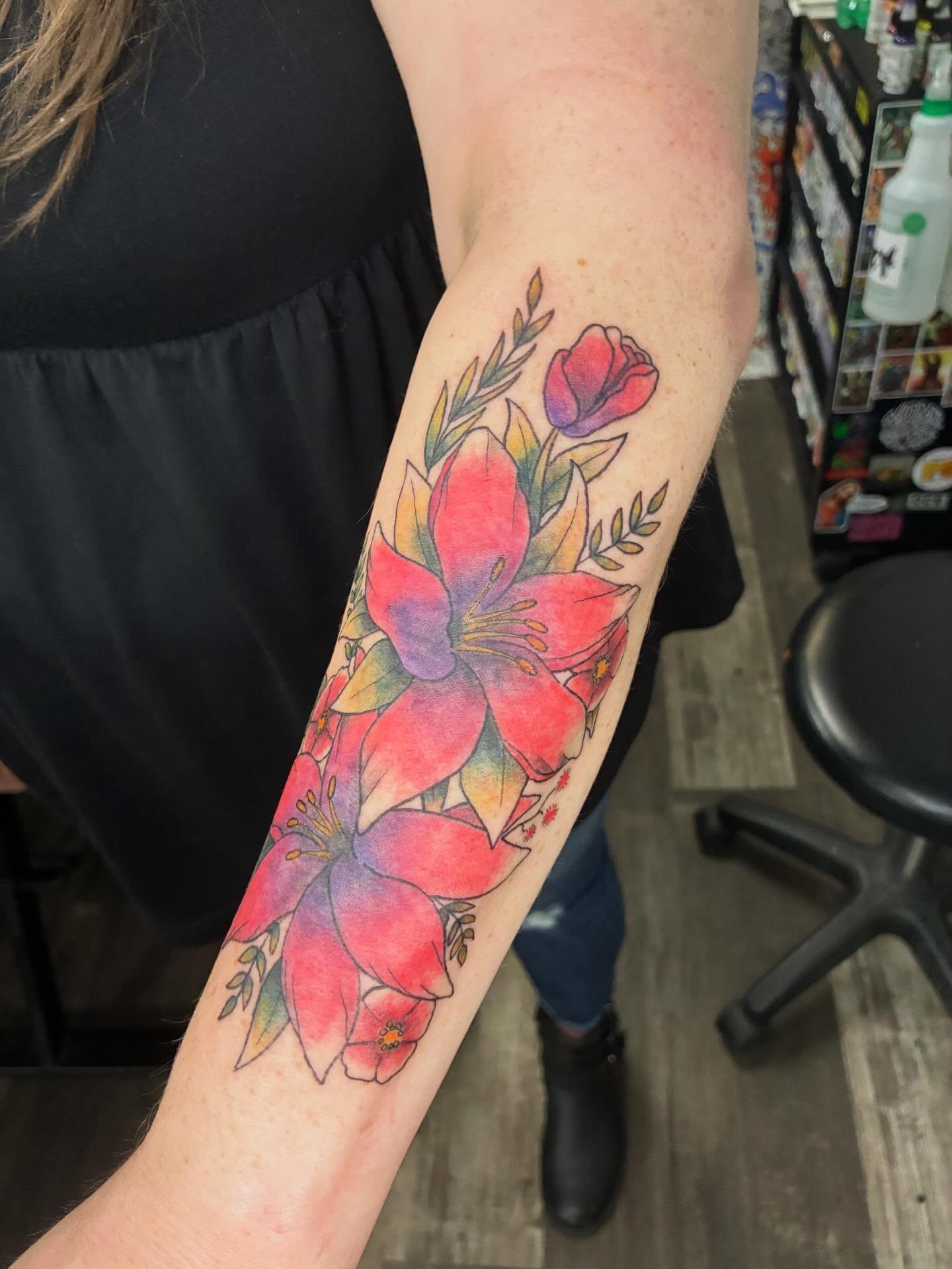 Floral arrangement watercolor tattoo on the forearm by Hit & Run Tattoo, Dayton, Ohio