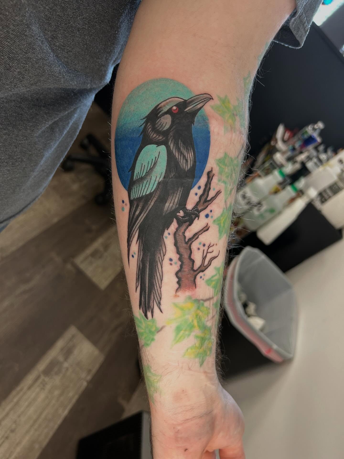 Crow American traditional tattoo on the forearm by Hit & Run Tattoo, Dayton, Ohio