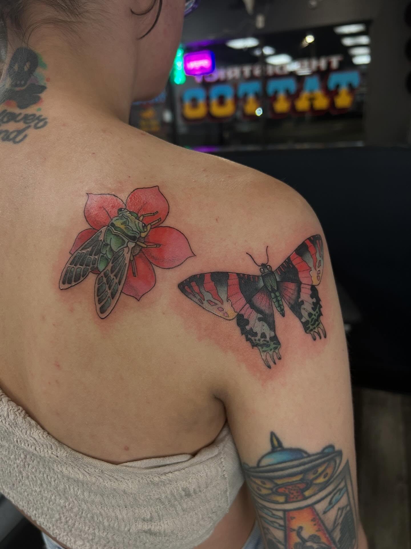 Butterfly and flower realism tattoo on the shoulder by Hit & Run Tattoo, Dayton, Ohio