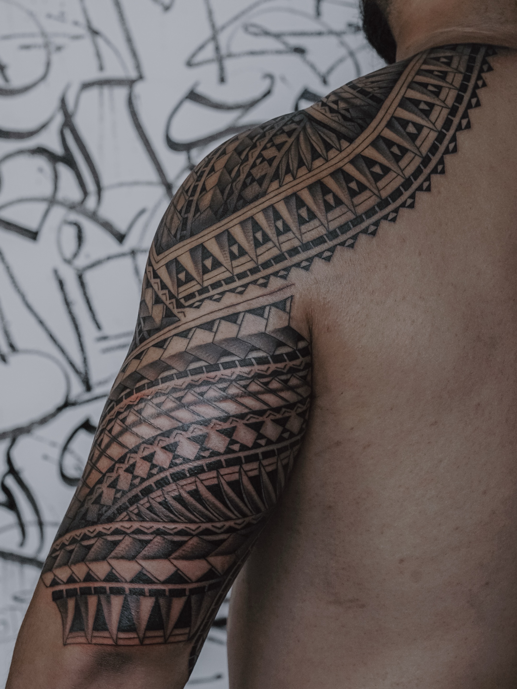 Tribal pattern tribal tattoo on the shoulder by TATTOOS by DESMOND