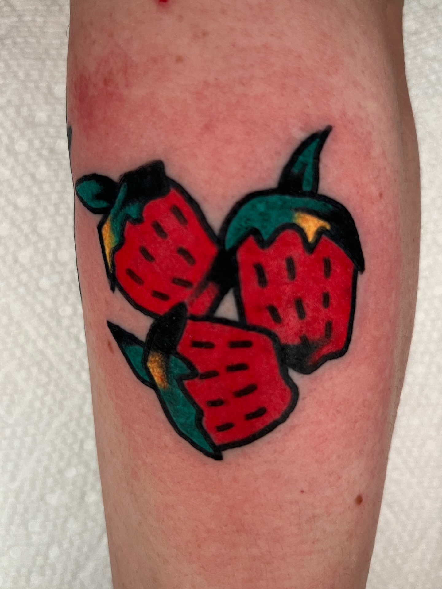 Strawberries American traditional tattoo on the forearm by Like A Horse Corral