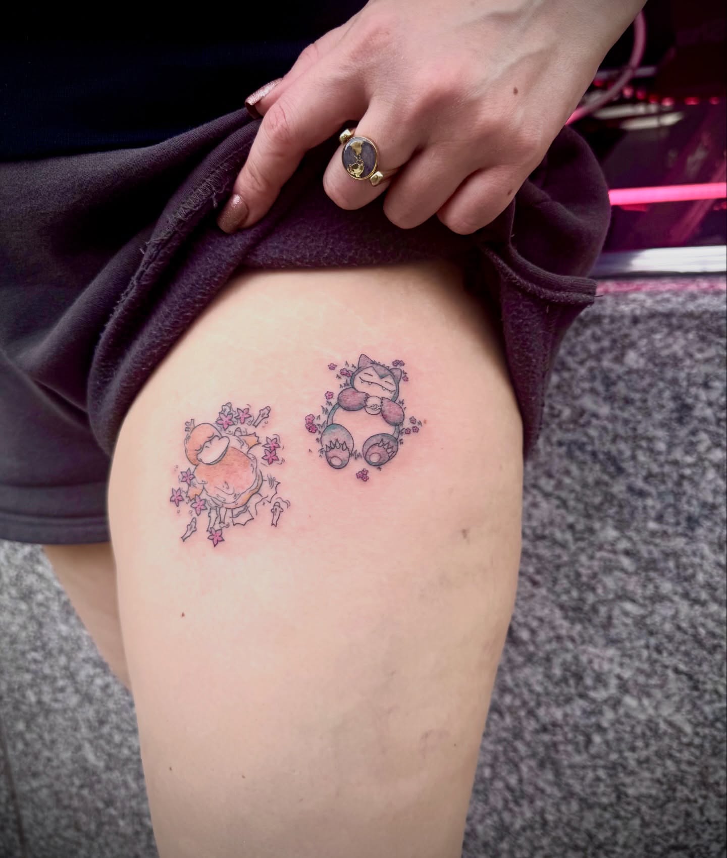Chibi characters anime tattoo on the thigh by Kylie Allen