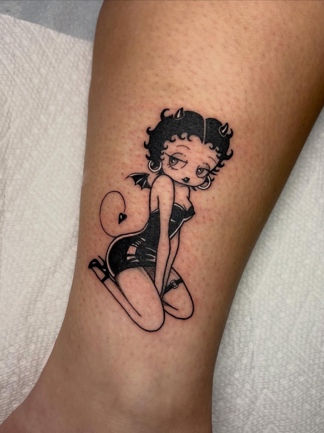 Betty Boop as devil neo-traditional tattoo on the forearm by ⓣⓞⓡⓘ, Bangor, Maine