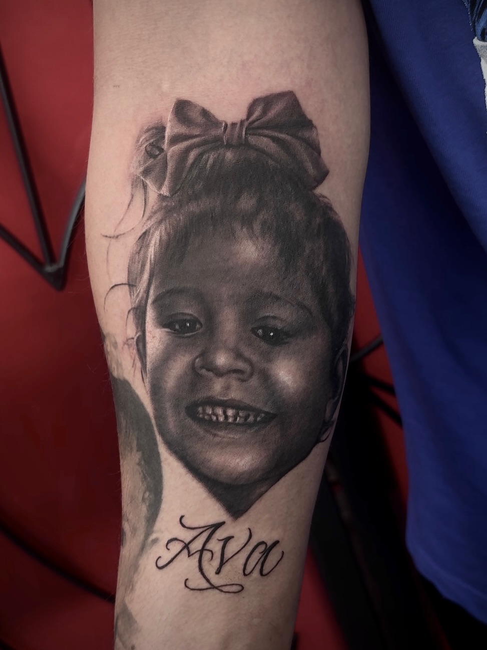 Child portrait realism tattoo on the forearm by Ben Loredo
