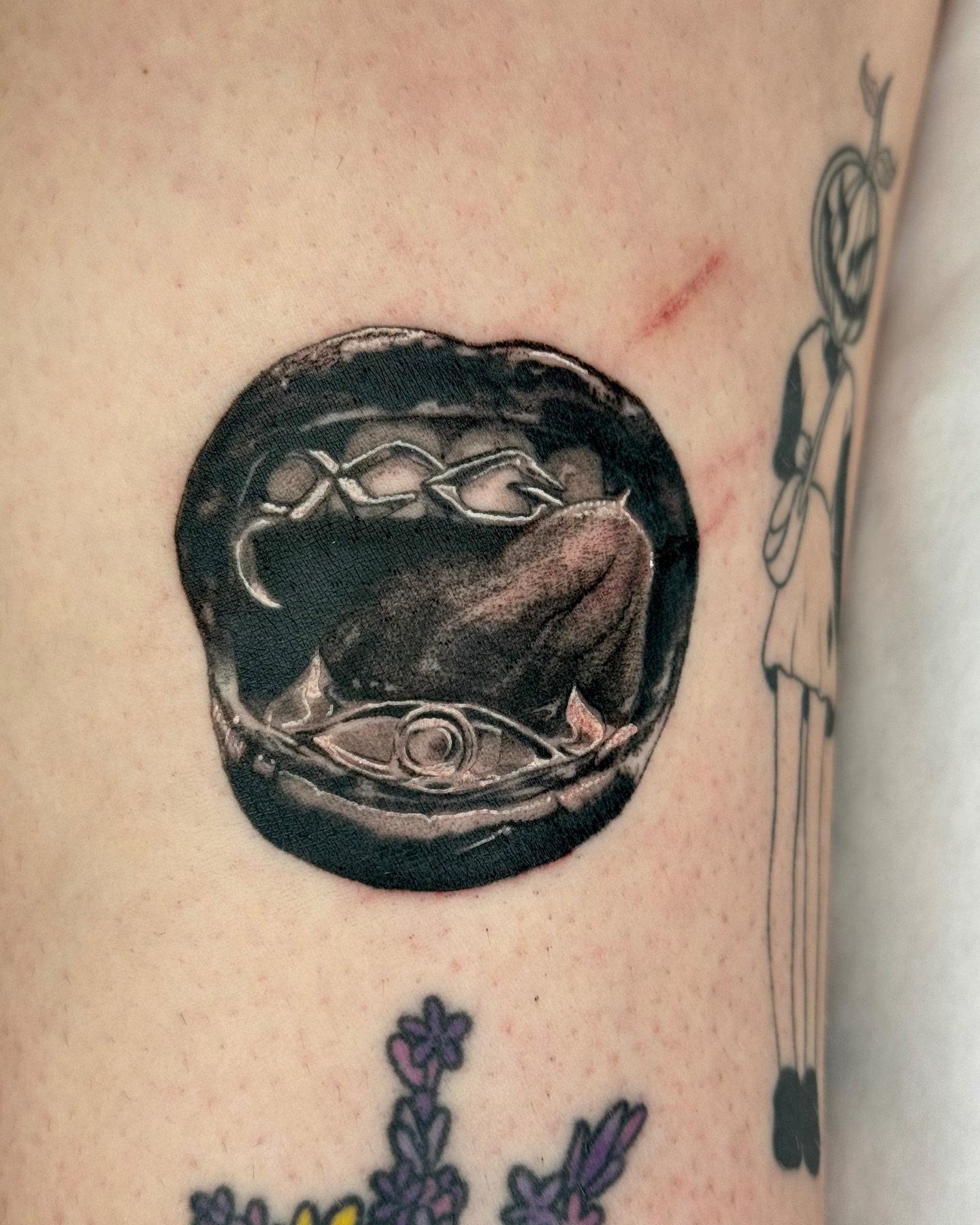 Abstract organic form realism tattoo on the forearm by Em Krieg