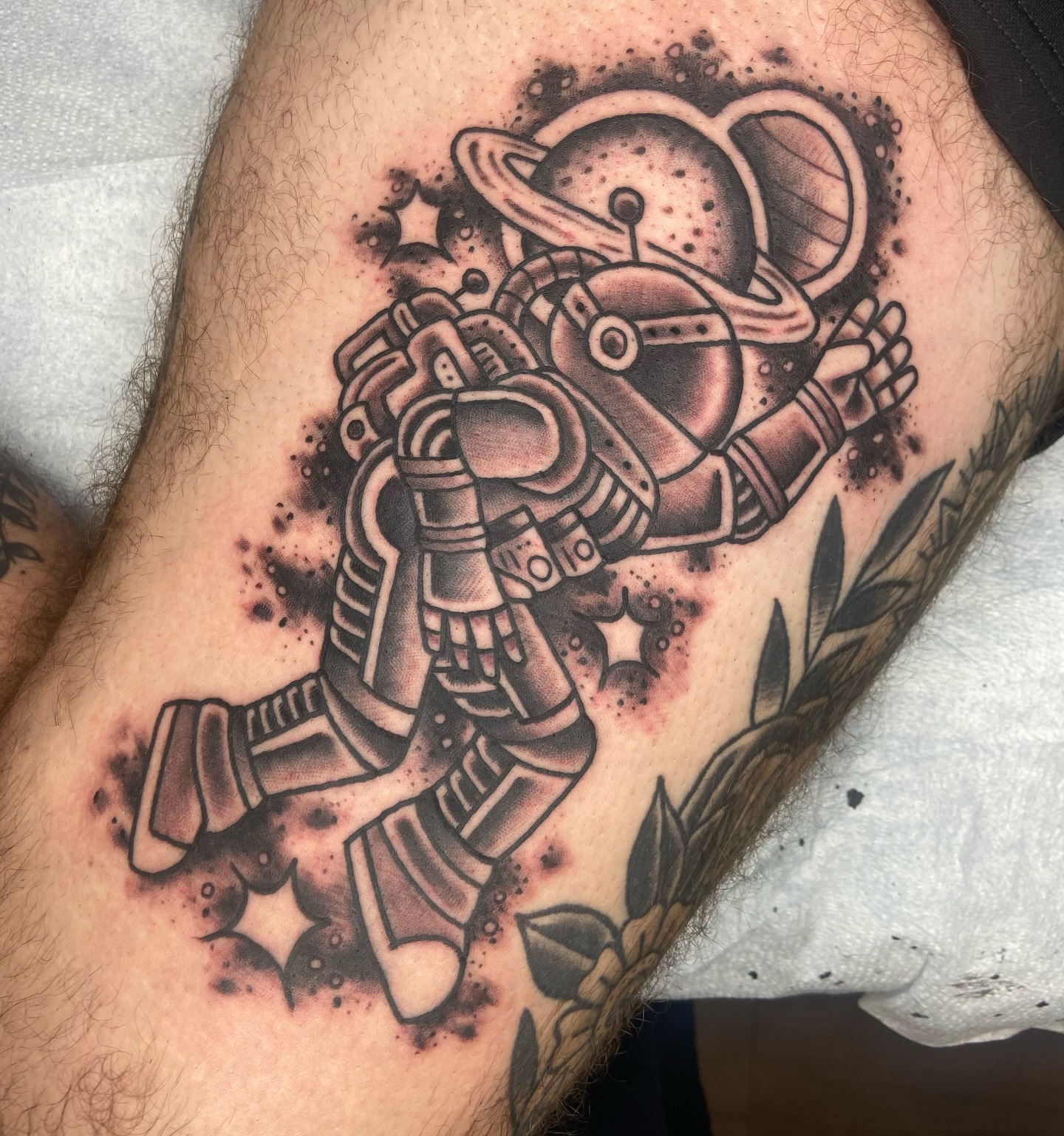 Astronaut black and grey tattoo on the thigh by nicholas mcevoy, Boston, Massachusetts