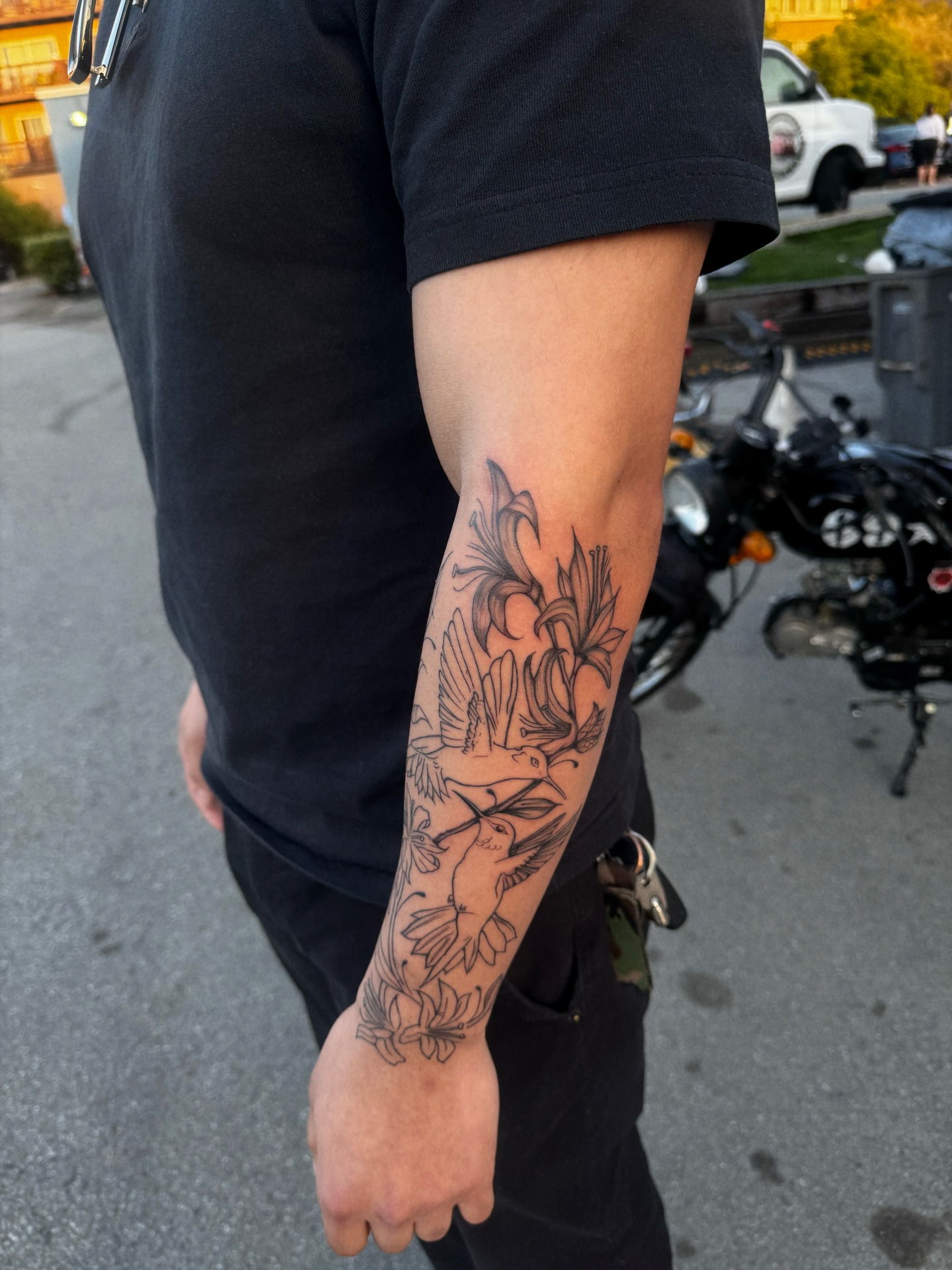 Lilies and birds black and grey tattoo on the forearm by 🕸️EC🥷🏼🌁🇲🇽🕸️