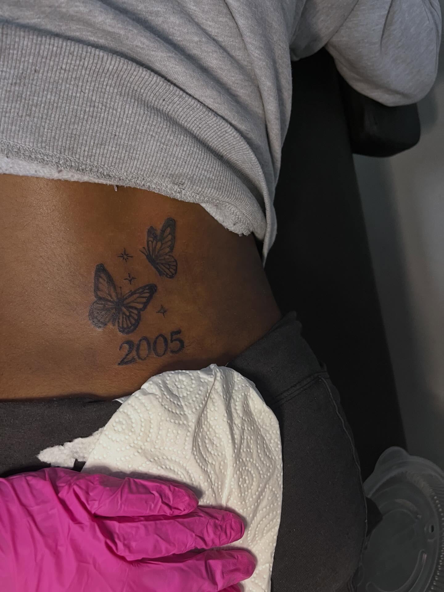 Butterflies and year black and grey tattoo on the torso by π Westside