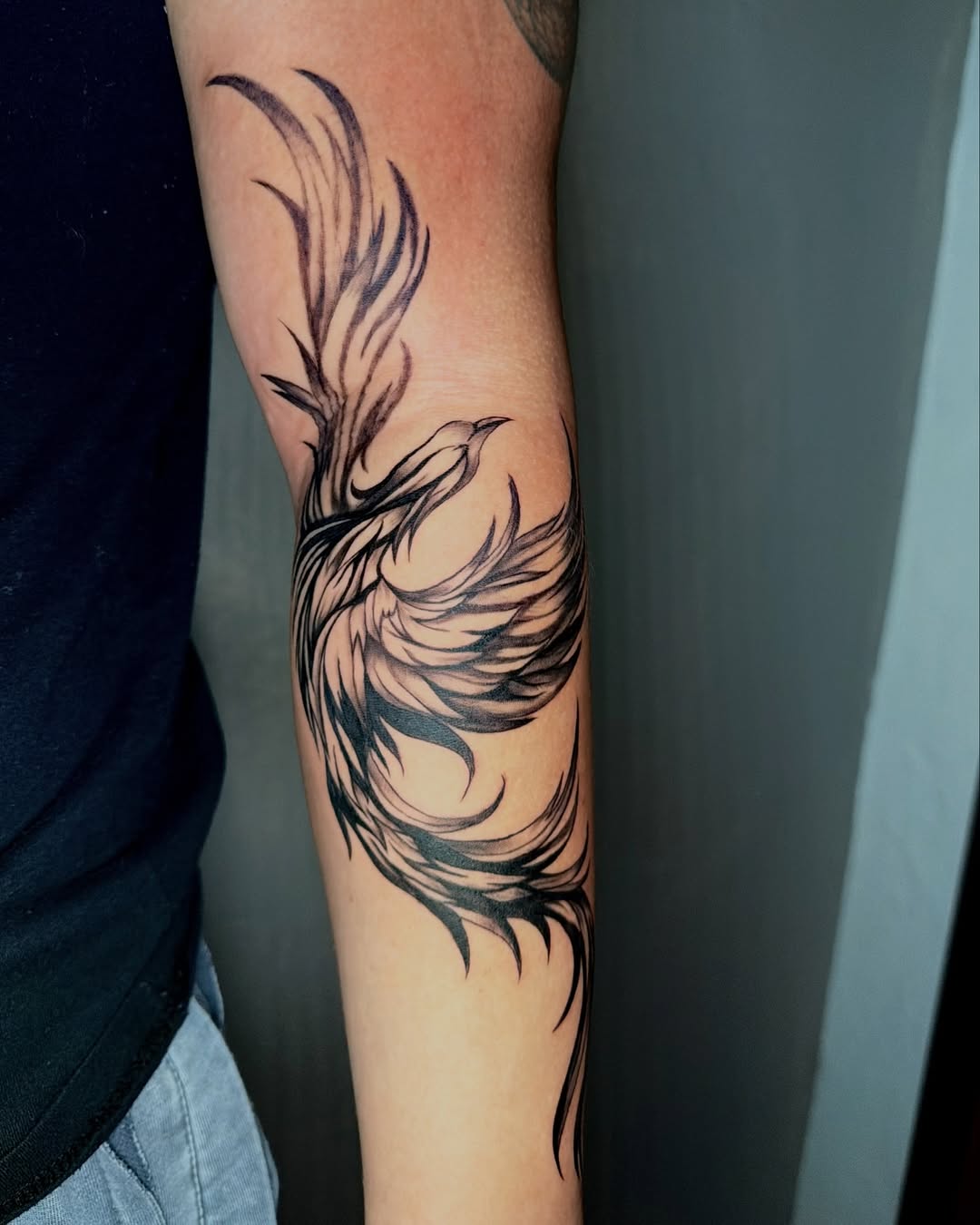 Phoenix realism tattoo on the forearm by jayla pantig