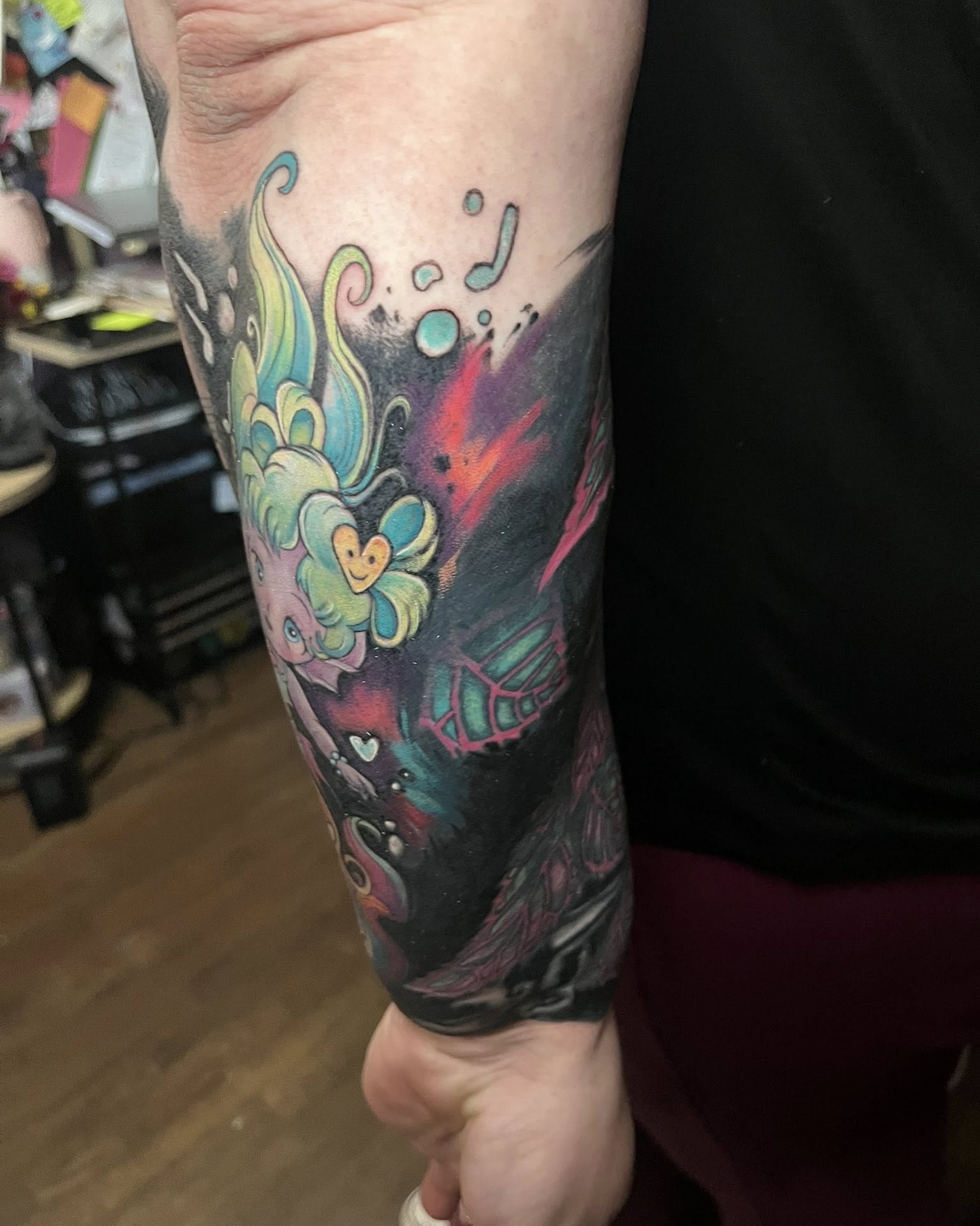 Flower and butterfly new school tattoo on the forearm by SJ