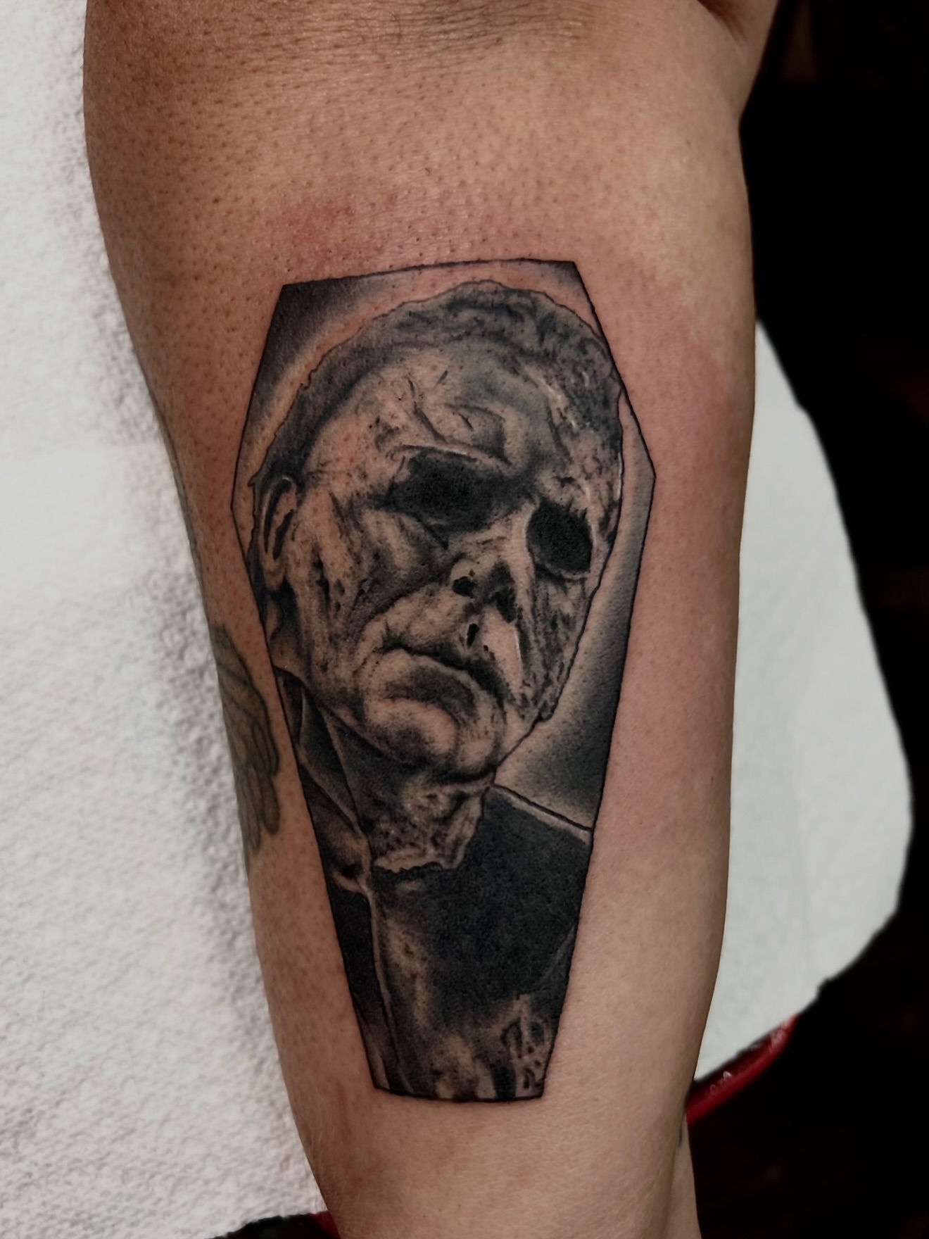 Michael Myers realism tattoo on the forearm by Josh Kronauer