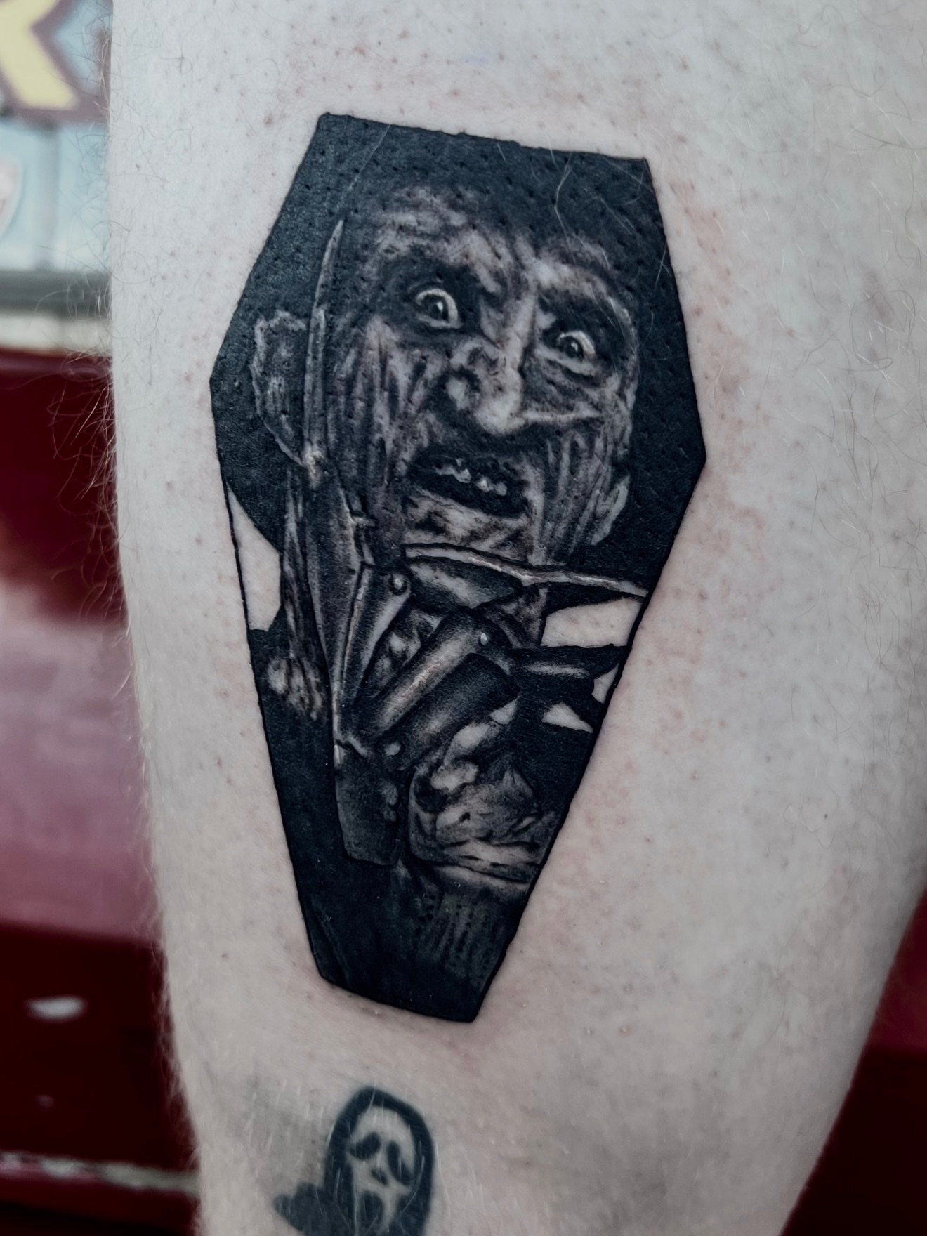 Zombie in coffin realism tattoo on the forearm by Josh Kronauer