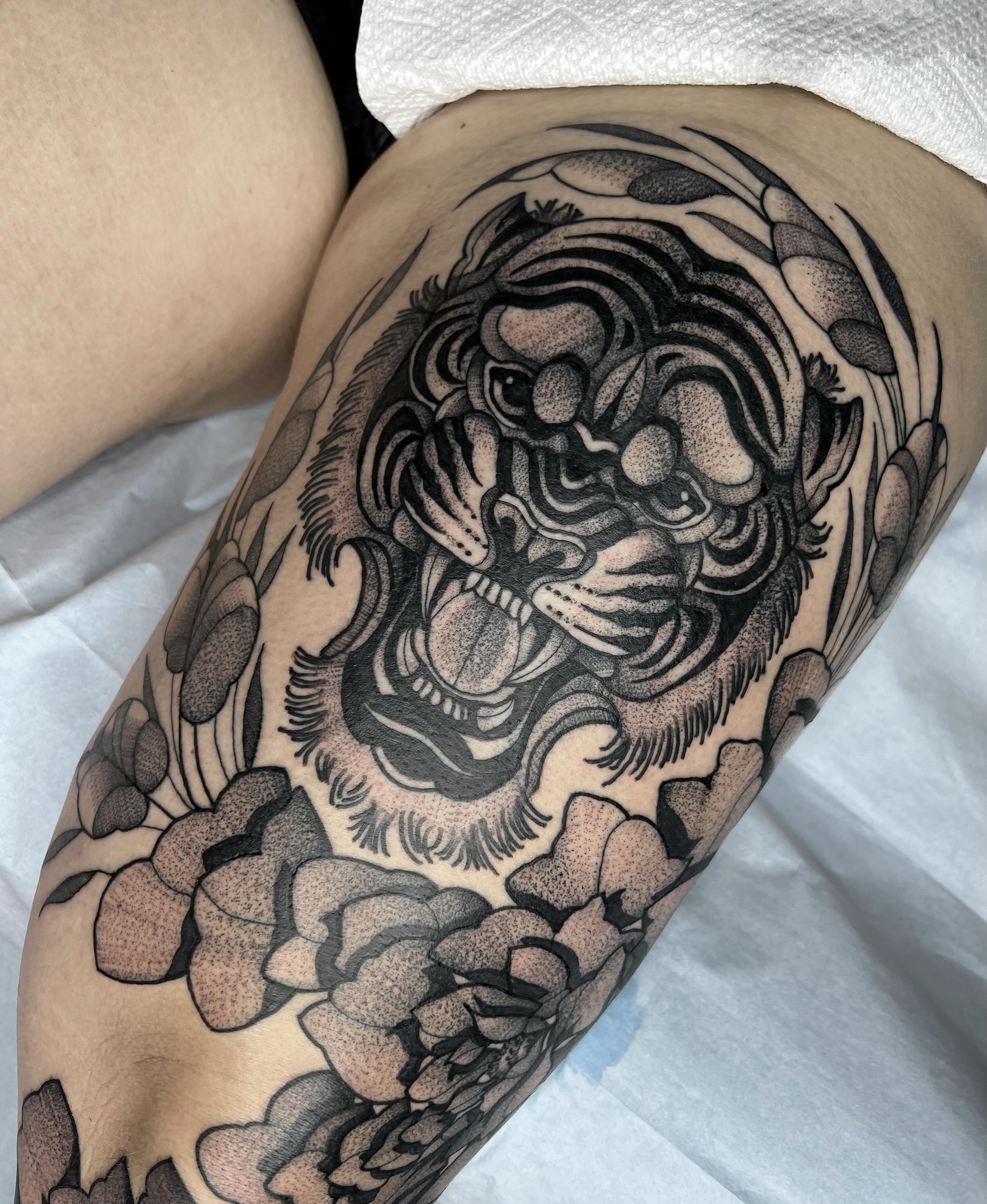 Tiger dotwork tattoo on the thigh by Harlee Hornsby