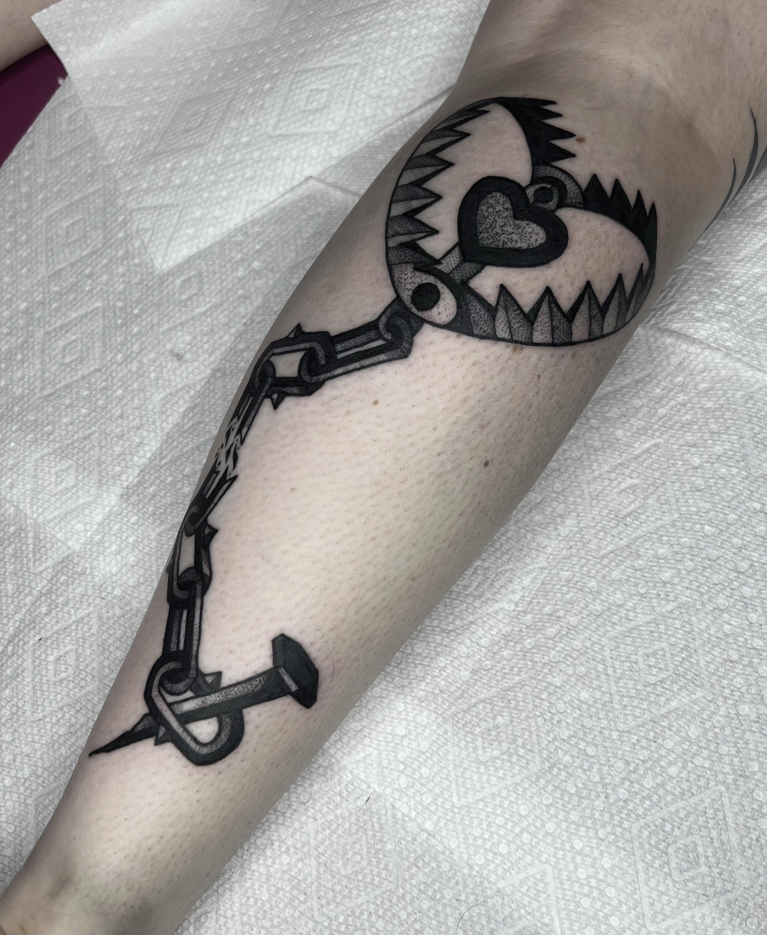 Key with heart black and grey tattoo on the forearm by Harlee Hornsby