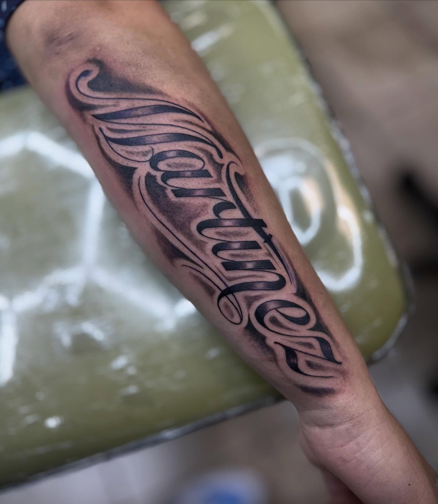 Script lettering lettering script tattoo on the forearm by Chuy E ⚡️