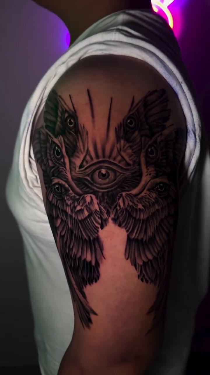 Realism tattoo on the upper arm by Houston Tattoo Artist