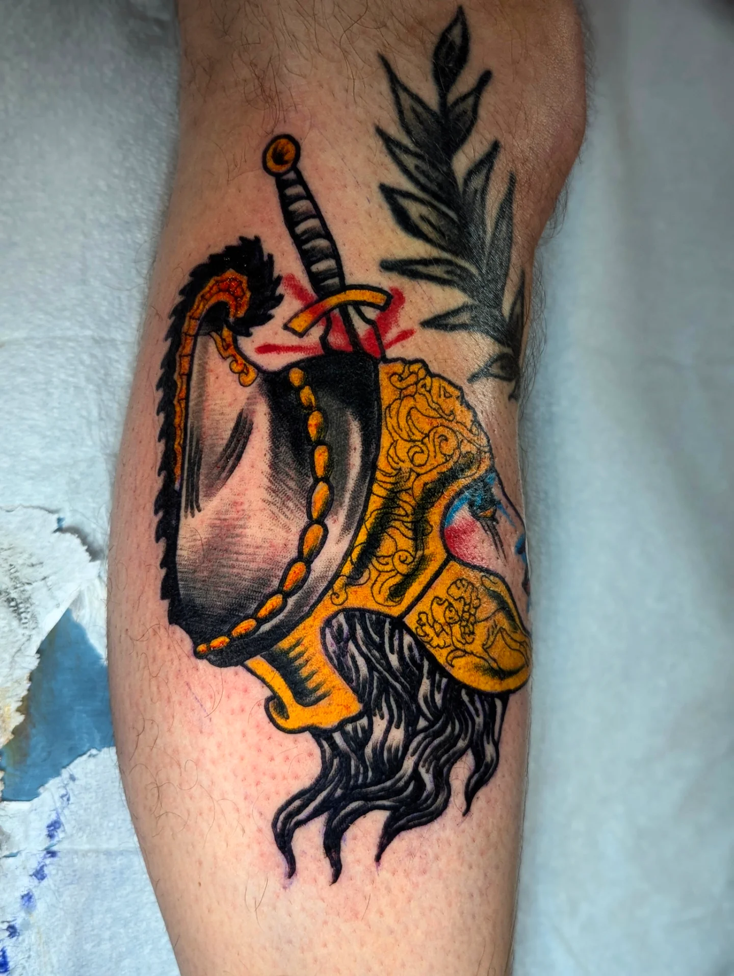 Sword and shield American traditional tattoo on the forearm by Eric Ward
