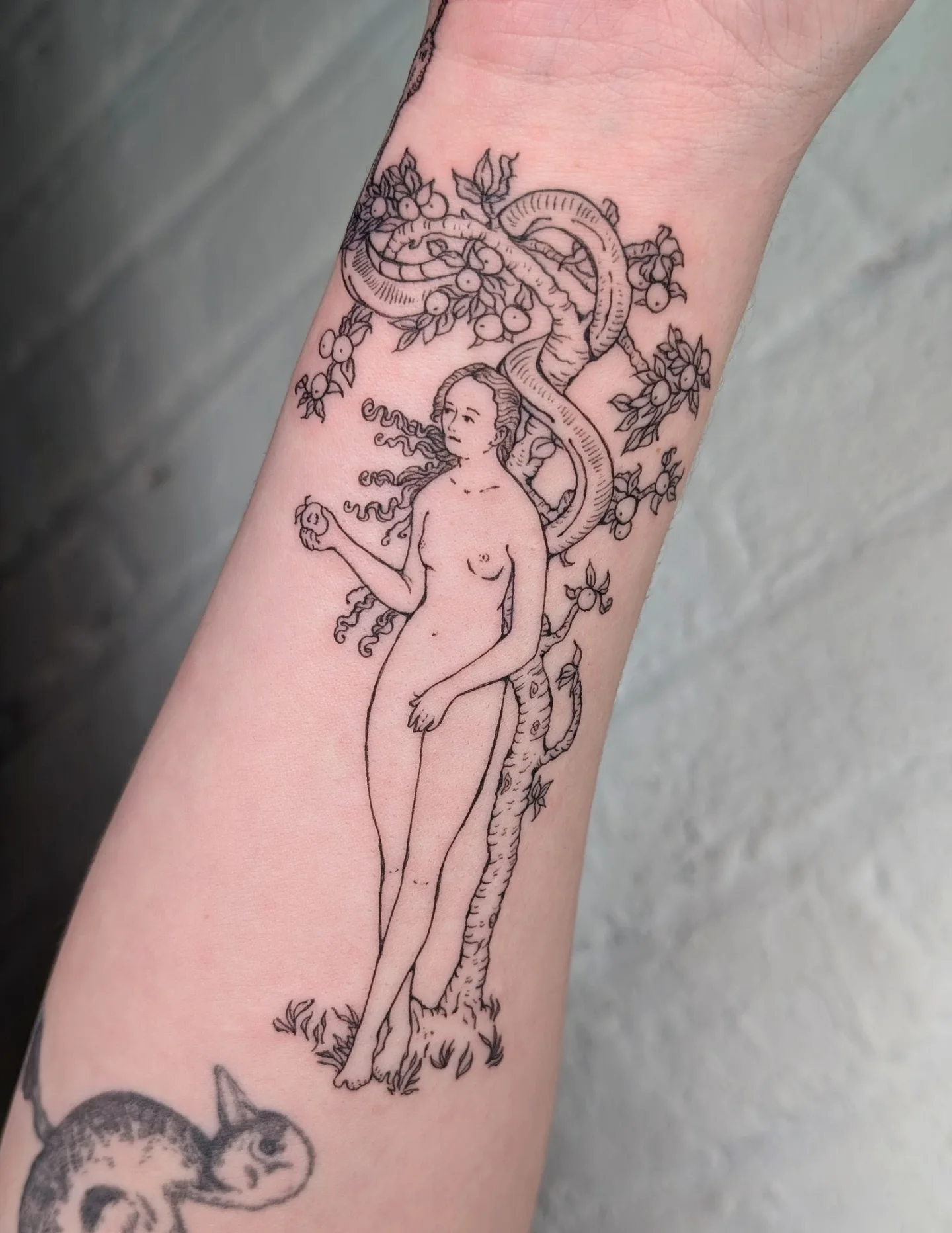 Adam and snake black and grey tattoo on the forearm by mila