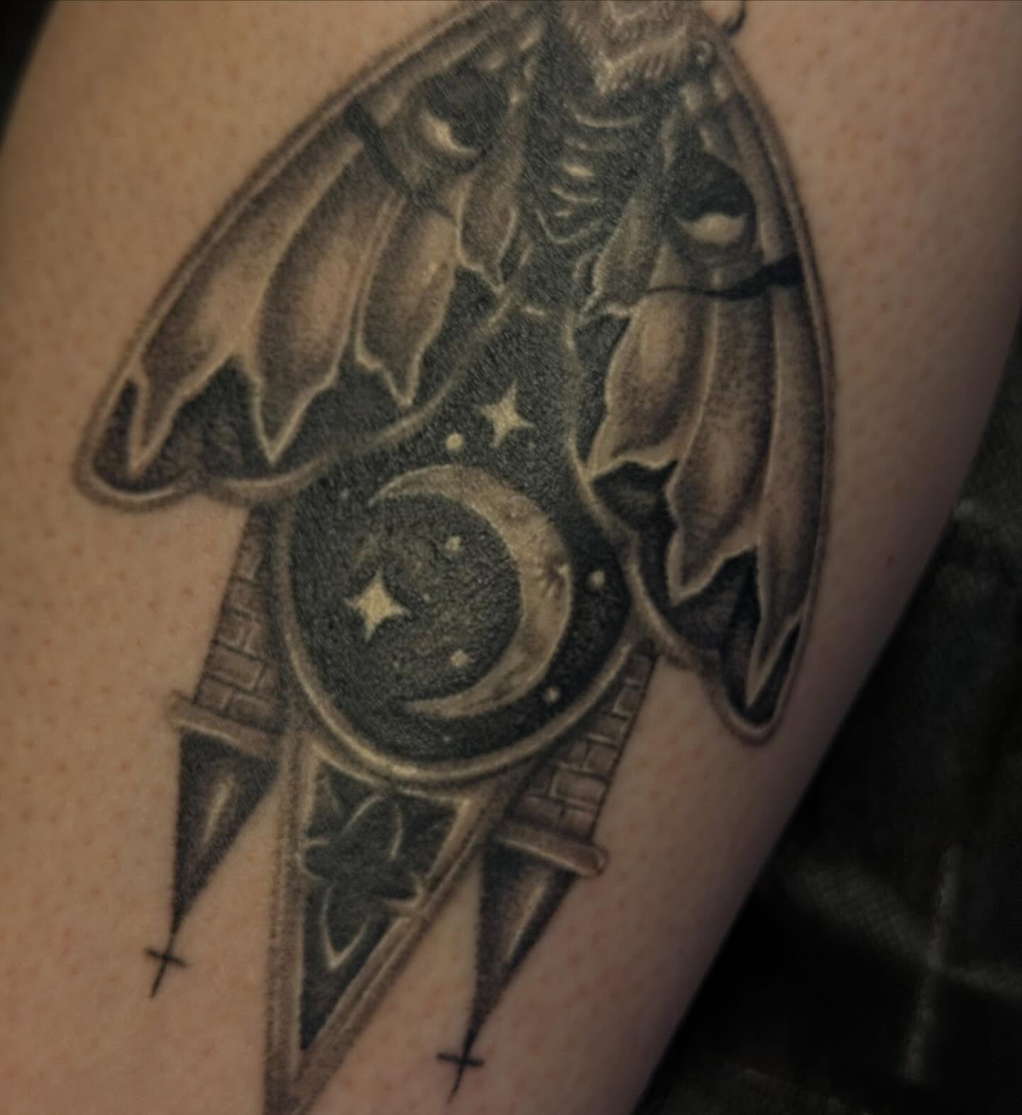 Bat and moon realism tattoo on the forearm by Yvonne