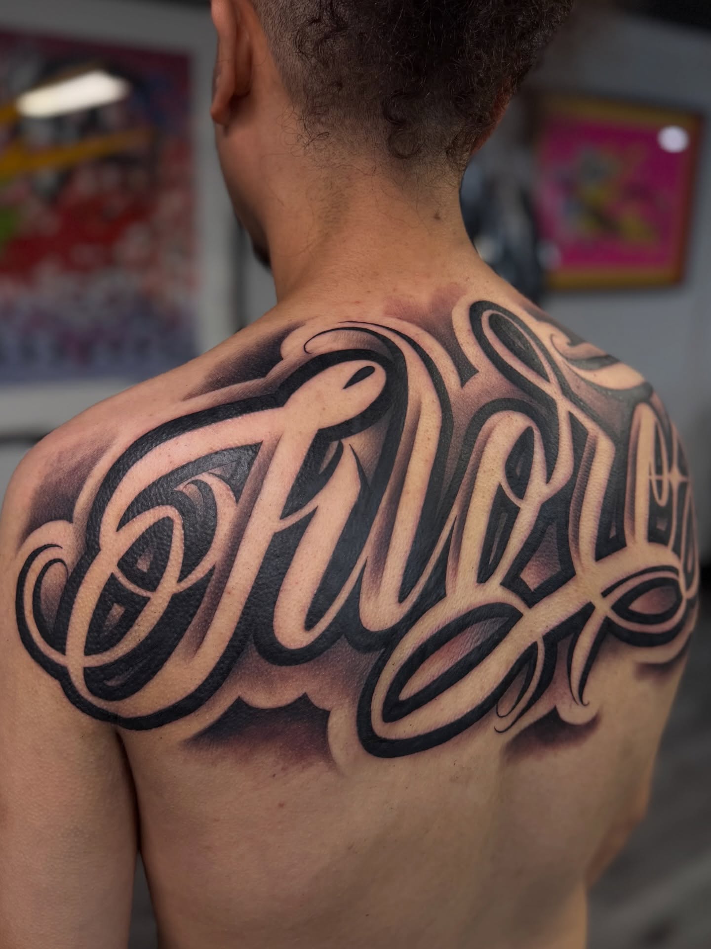 Script lettering lettering script tattoo on the back by Rocky G Inkz LLC
