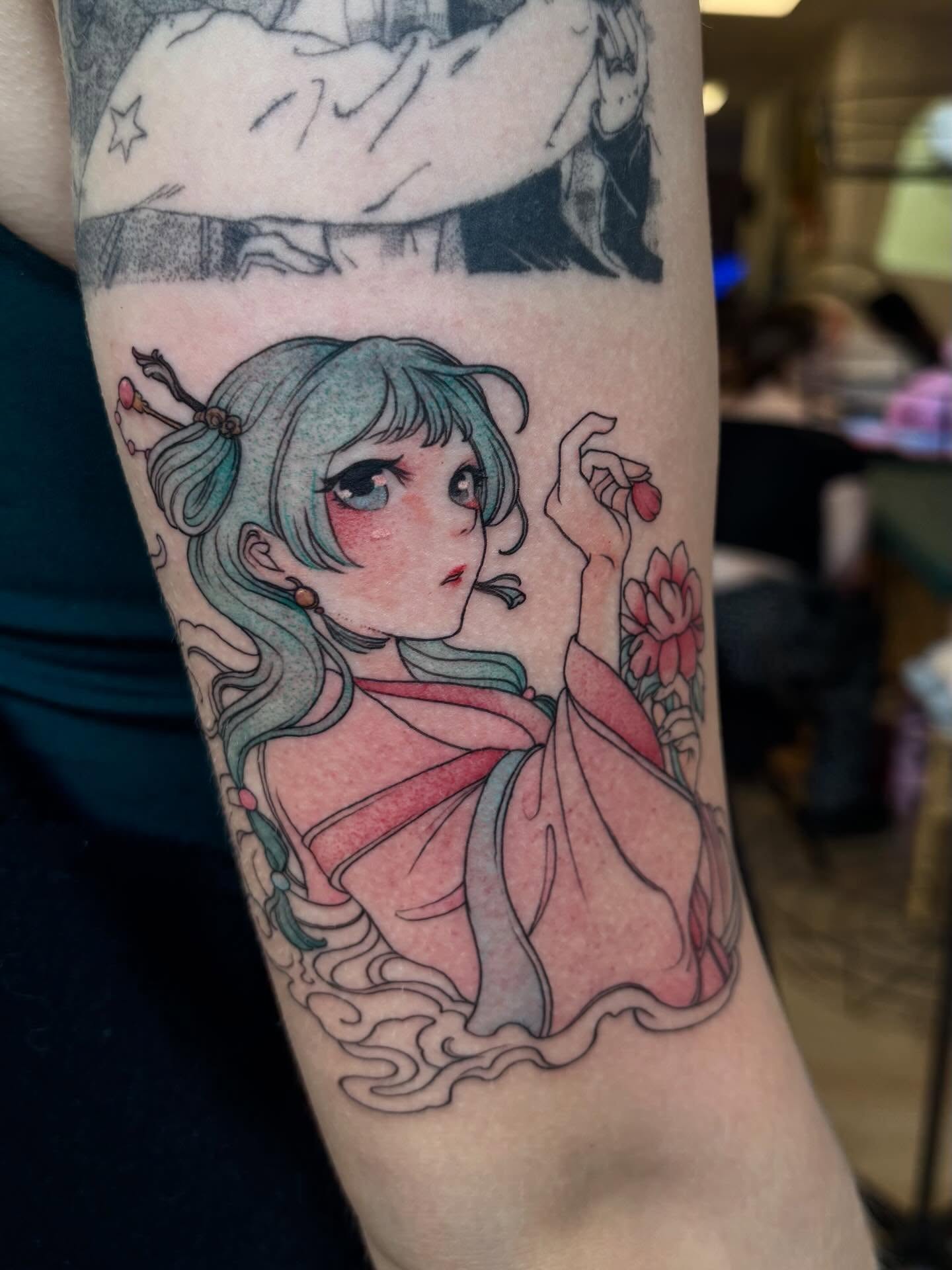 Anime-style girl anime tattoo on the forearm by joely