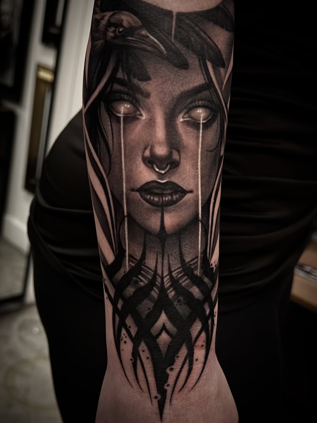 Woman with crow realism tattoo on the forearm by Las Vegas tattoo Artist