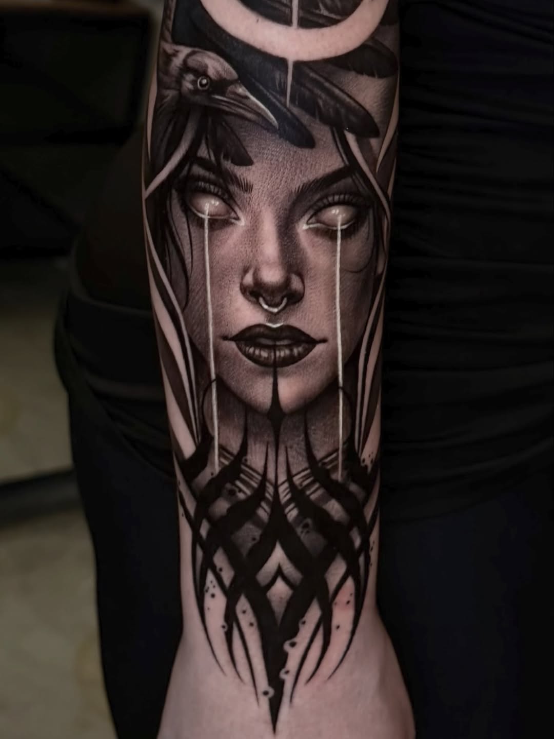 Woman with crow realism tattoo on the forearm by Las Vegas tattoo Artist
