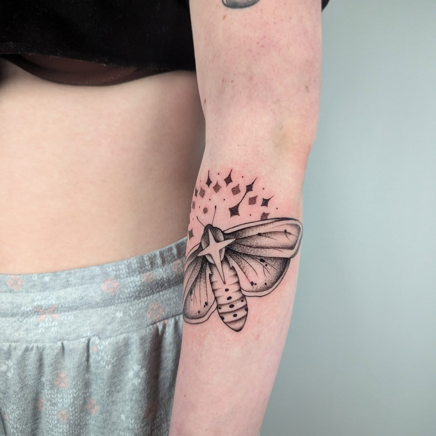 Moth dotwork tattoo on the forearm by Courtney Yaddof