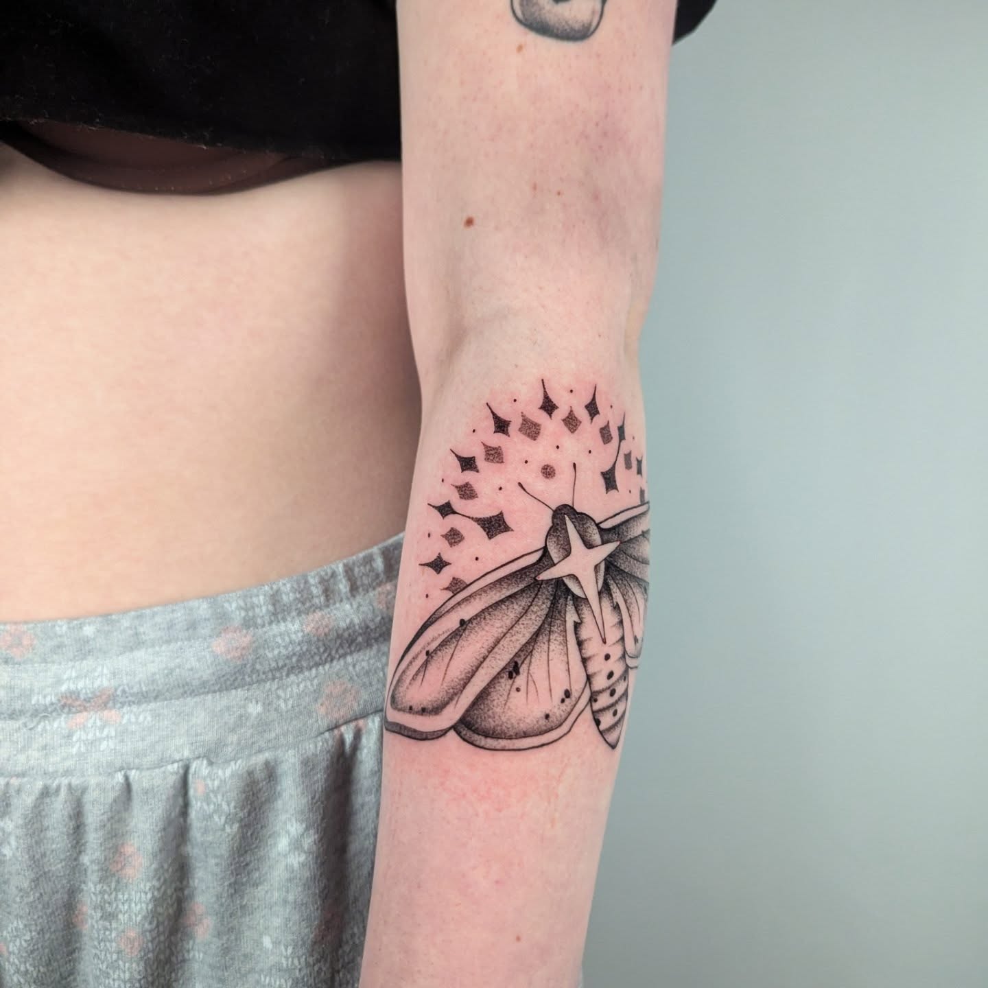 Moth dotwork tattoo on the forearm by Courtney Yaddof