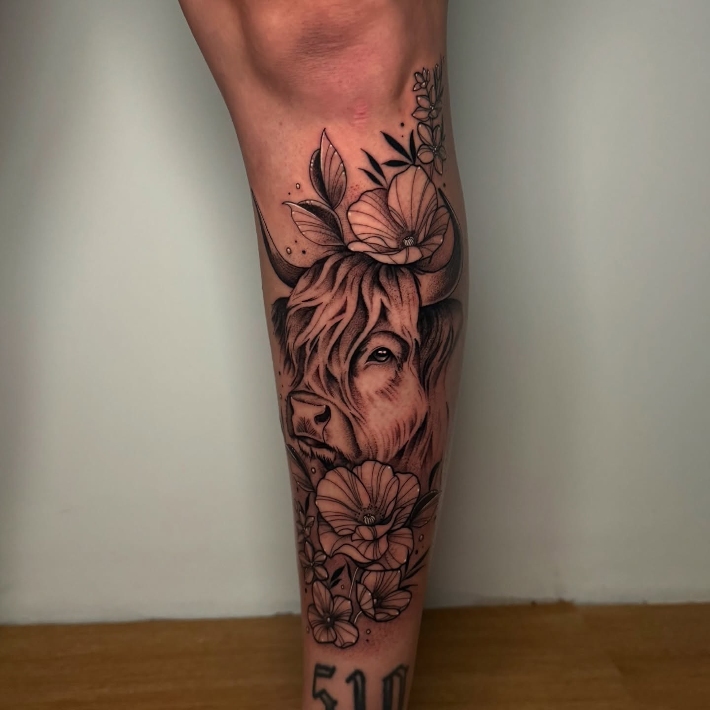 Bull and flowers realism tattoo on the forearm by ɪᴠᴏɴɴᴇ