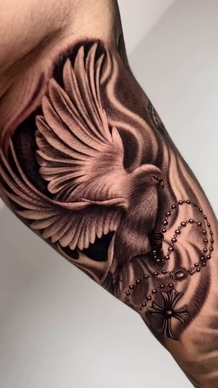 Dove with rosary realism tattoo by Fernando Andrade Jr