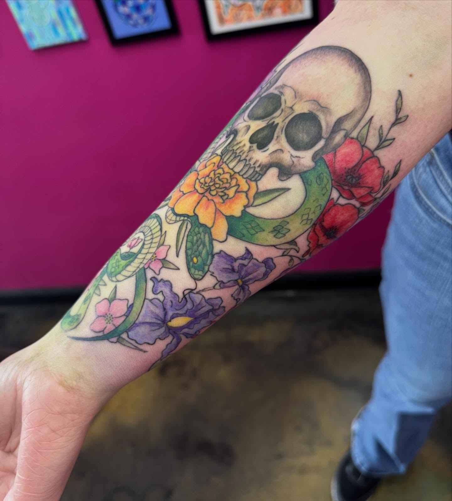 Skull and floral Chicano tattoo on the forearm by Jada Reynolds