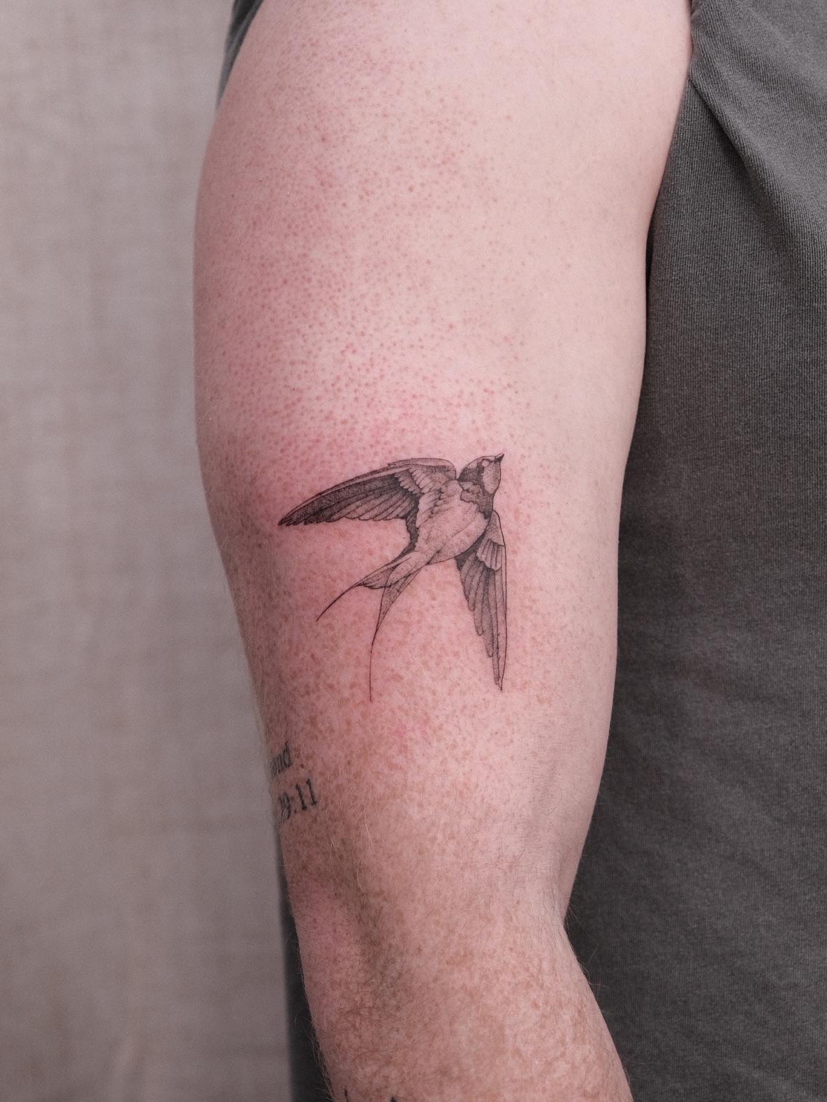 Swallow black and grey tattoo on the forearm by Houston Tattoo Artist GoldenK