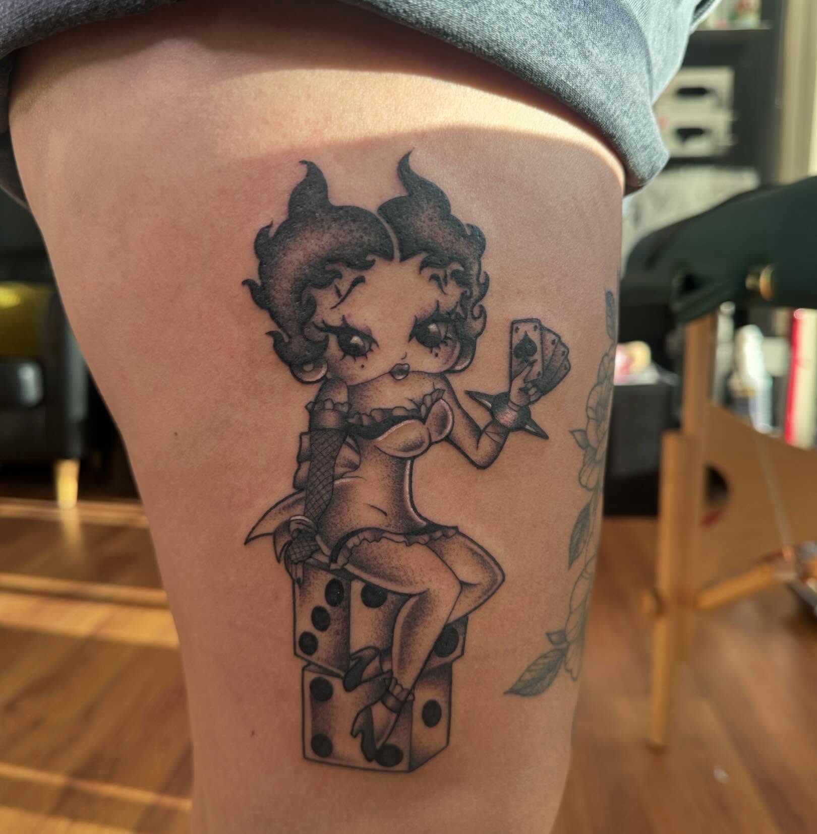 Betty Boop black and grey tattoo on the thigh by Tattoo, San Diego, California